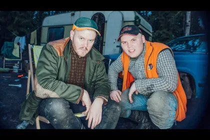 Two fat men sitting in front of husvagn jigsaw puzzle