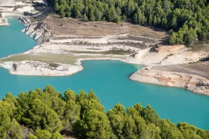 Blue lake surrounded by trees jigsaw puzzle