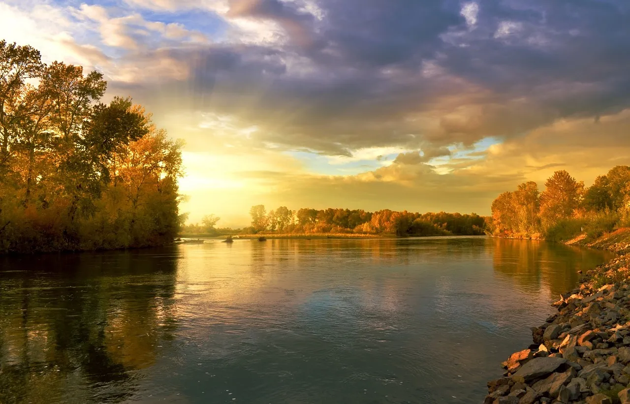 Sunset over tranquil river scene