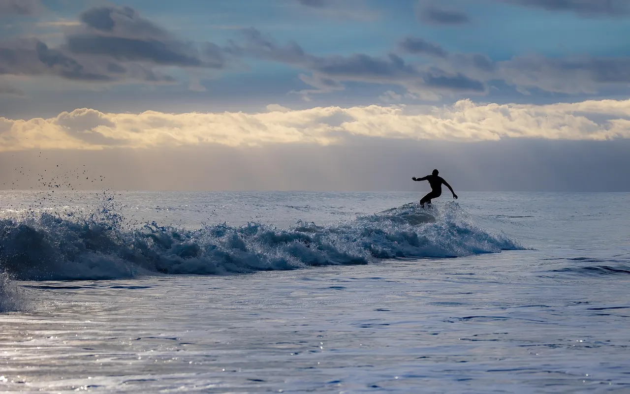 Surfer Riding Ocean Wave