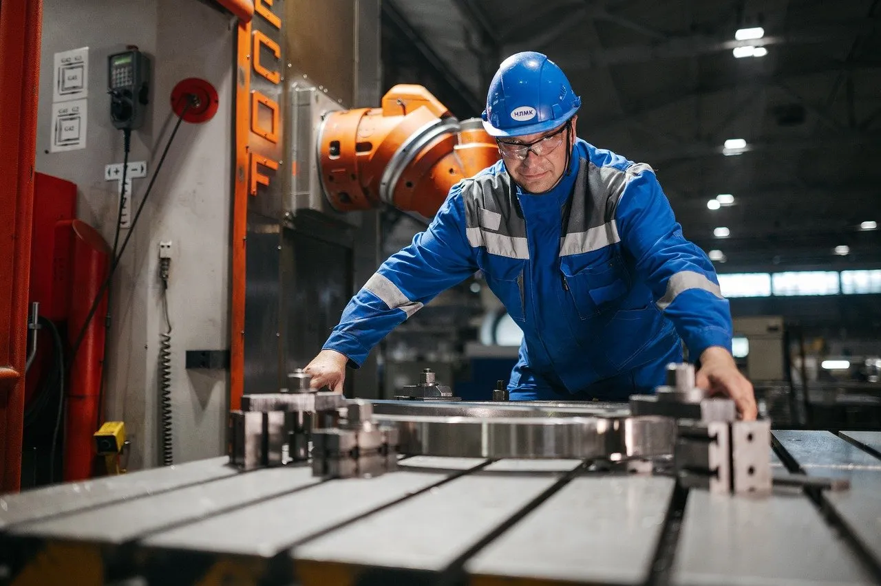 Factory Worker Operating Machinery