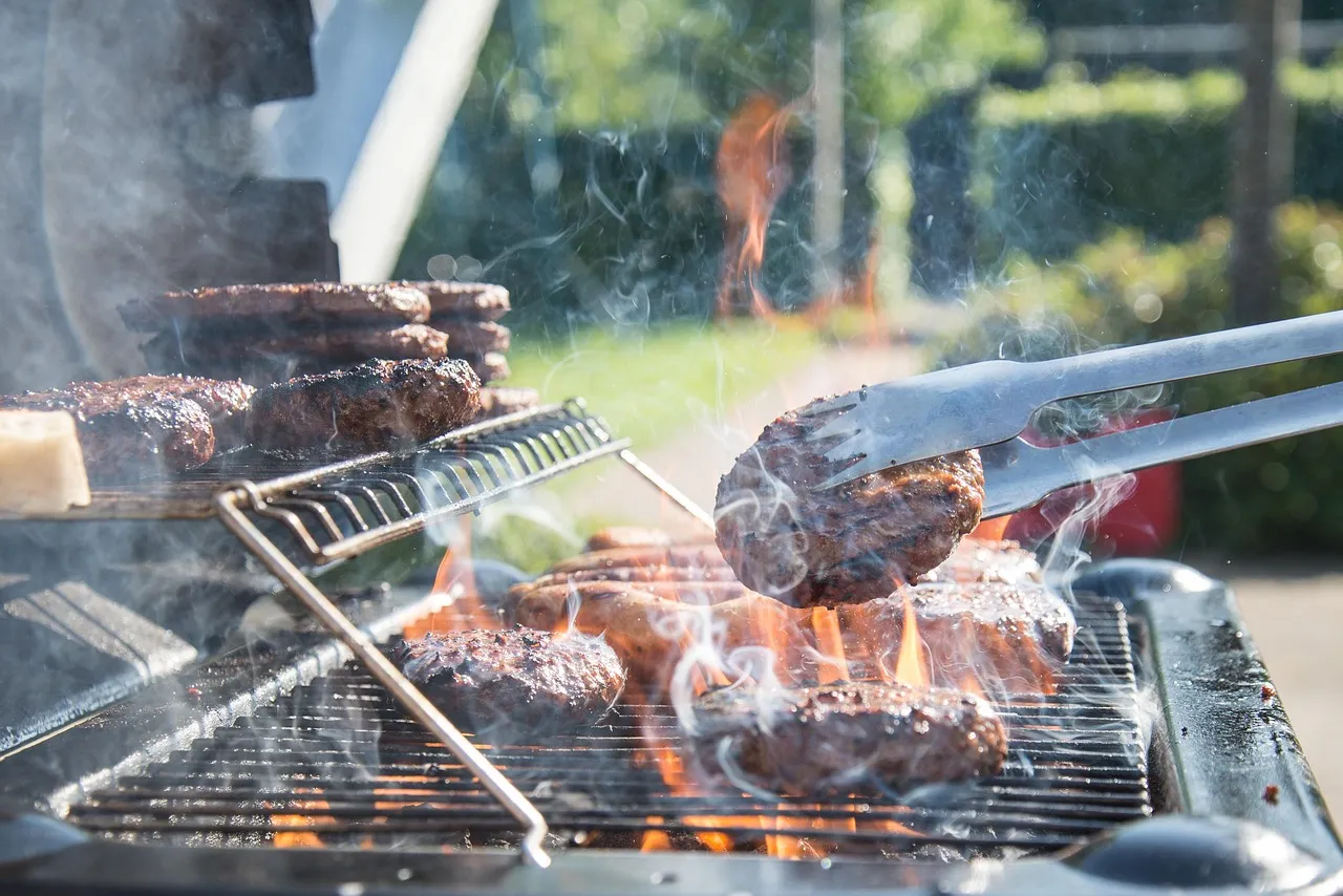 Grilling burgers outdoors